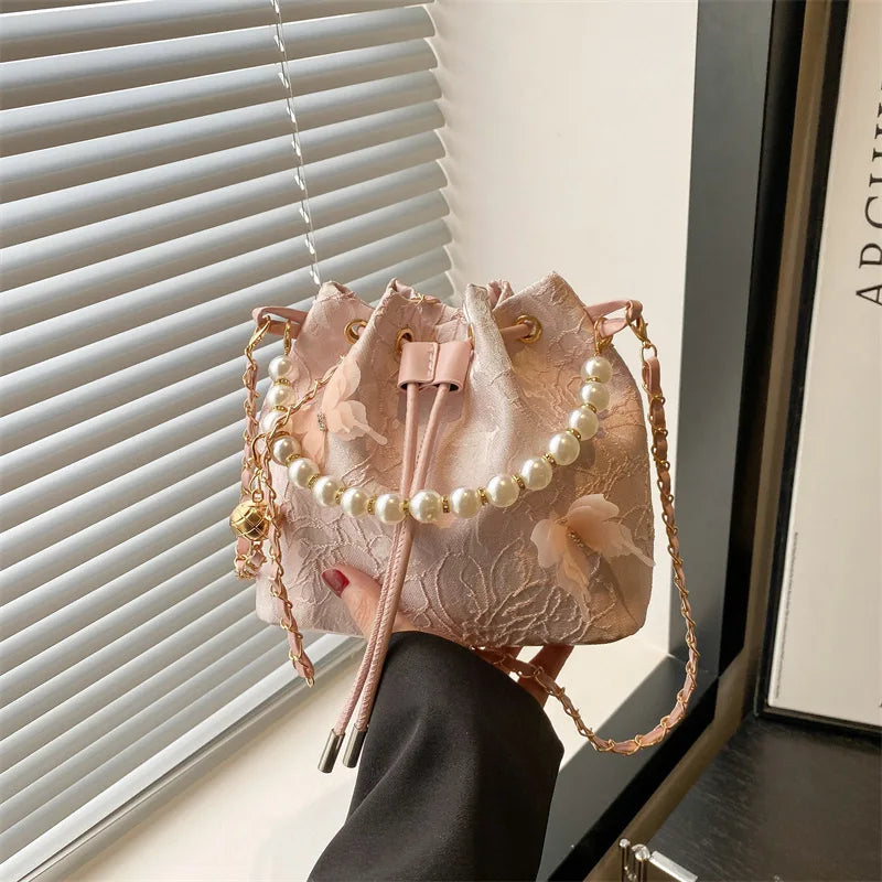 Women's butterfly bucket shoulder bag by MAIRA'S COLLECTIONS featuring a colorful butterfly design and adjustable shoulder strap.