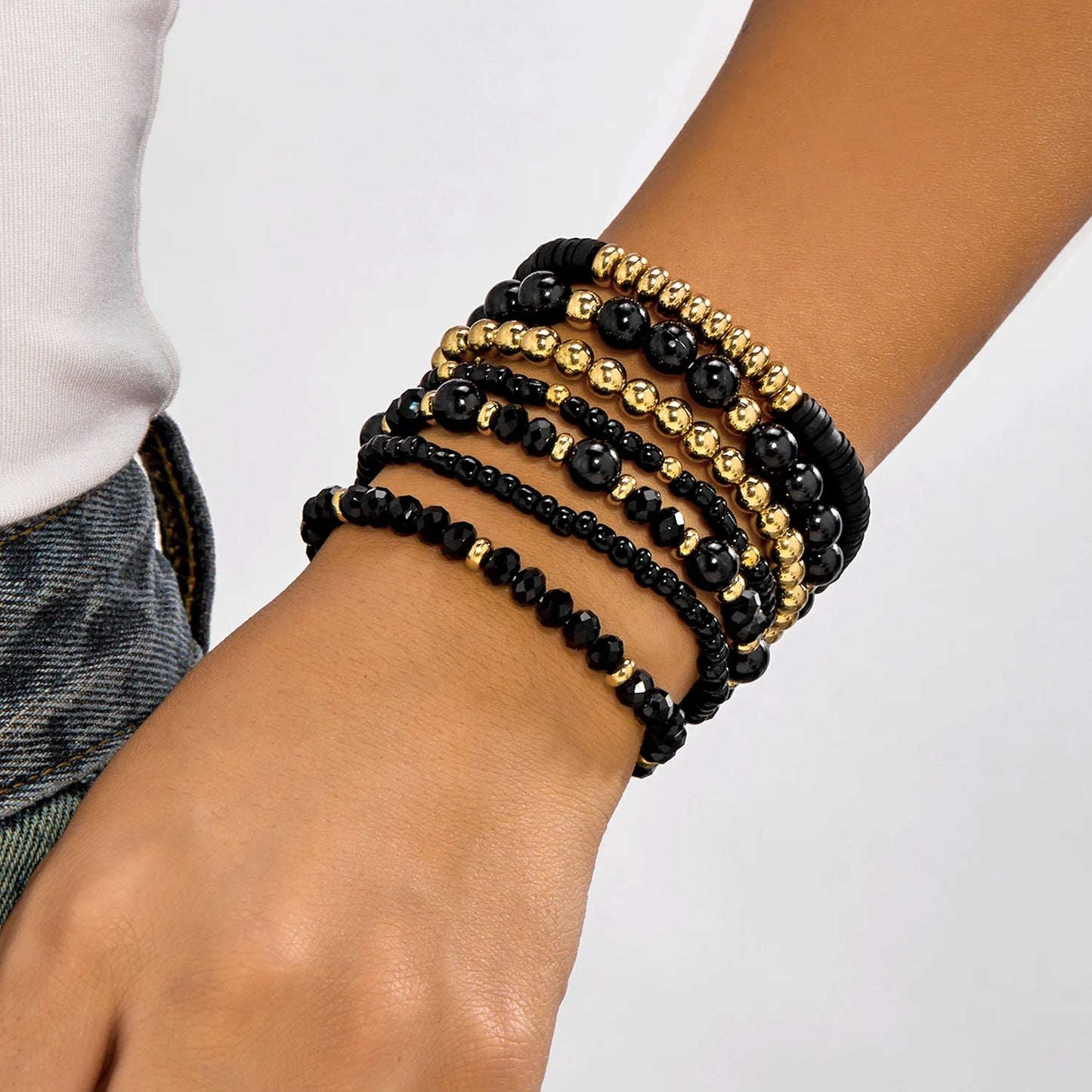 Bohemian wood beaded bracelet set with 10 colorful beaded bracelets from MAIRA'S COLLECTIONS displayed on a white background.