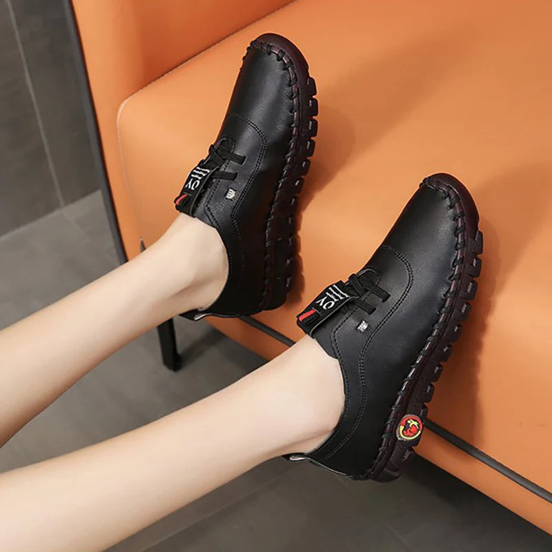 Women's leather sneakers by MAIRA'S COLLECTIONS featuring lace-up design and casual comfort, shown in a stylish side view.