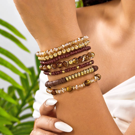 Bohemian wood beaded bracelet set with 10 colorful bracelets from MAIRA'S COLLECTIONS, featuring natural wooden beads and vibrant designs.