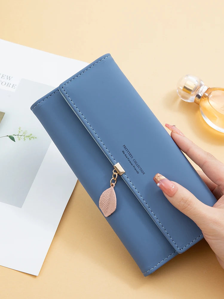Women's PU leather tri-fold bag by MAIRA'S COLLECTIONS with multiple compartments and stylish design.