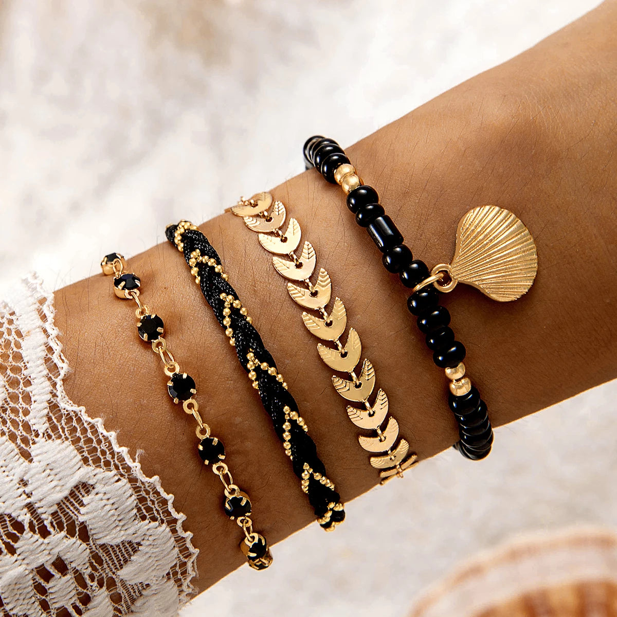 Set of five bohemian pearl bracelets from MAIRA'S COLLECTIONS featuring mixed pearl designs on a delicate thread.
