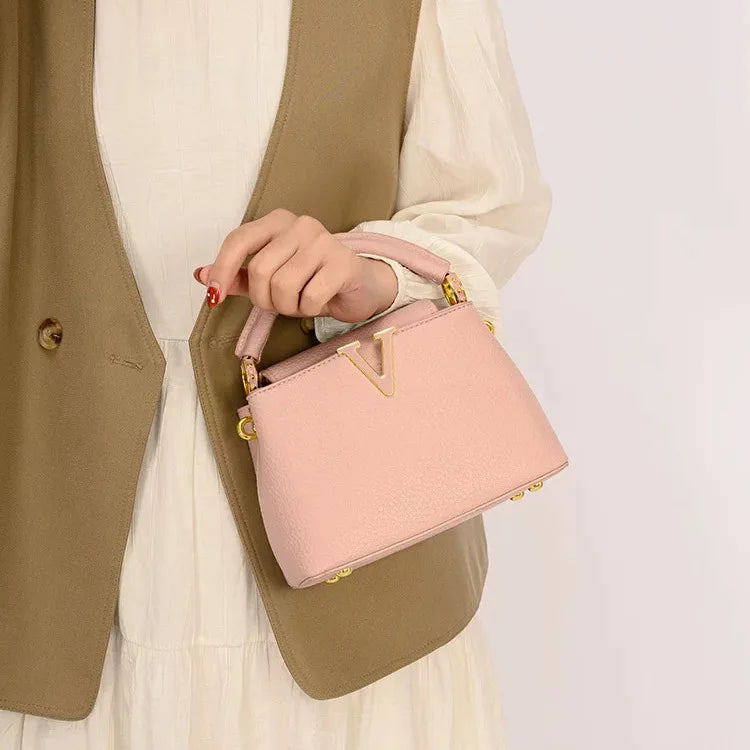 Women's luxury leather crossbody bag by MAIRA'S COLLECTIONS featuring sleek design and adjustable strap.