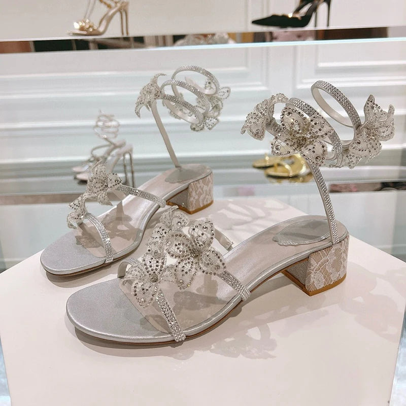 Women's rhinestone square heel sandals by MAIRA'S COLLECTIONS with sparkling embellishments and open toe design.