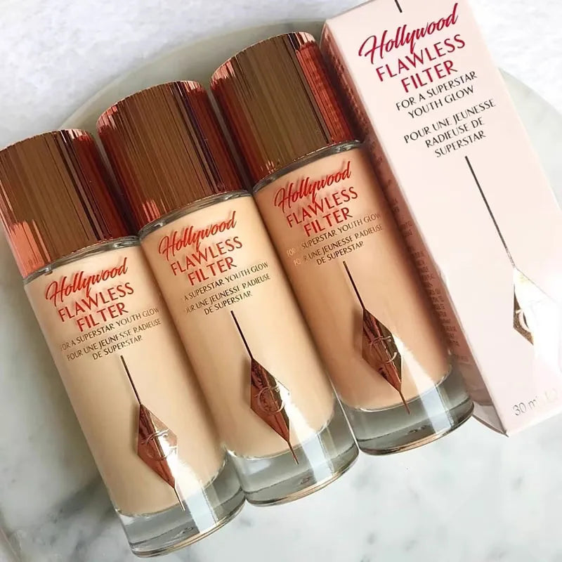 MAIRA'S COLLECTIONS CT Starlight Liquid Flawless Glow Primer in a sleek bottle with a shimmering liquid formula.