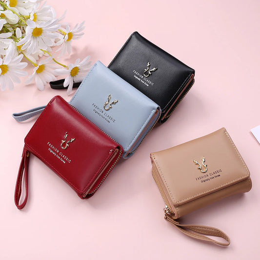 Women's PU leather mini wallet by MAIRA'S COLLECTIONS with card slots and compact design, shown in black.