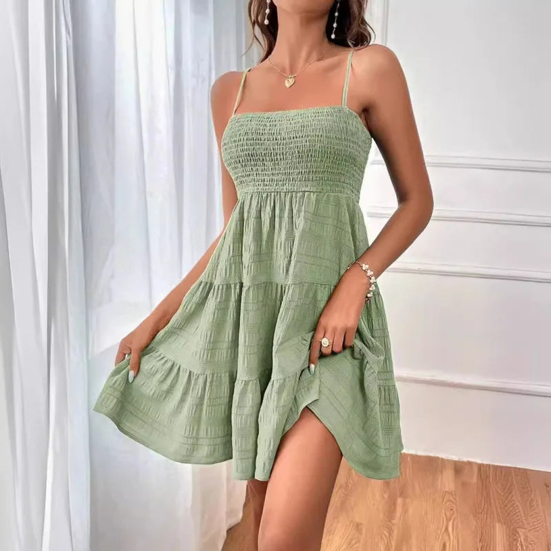 Women's smocked mini dress by MAIRA'S COLLECTIONS featuring a fitted bodice and short sleeves, perfect for casual summer wear.