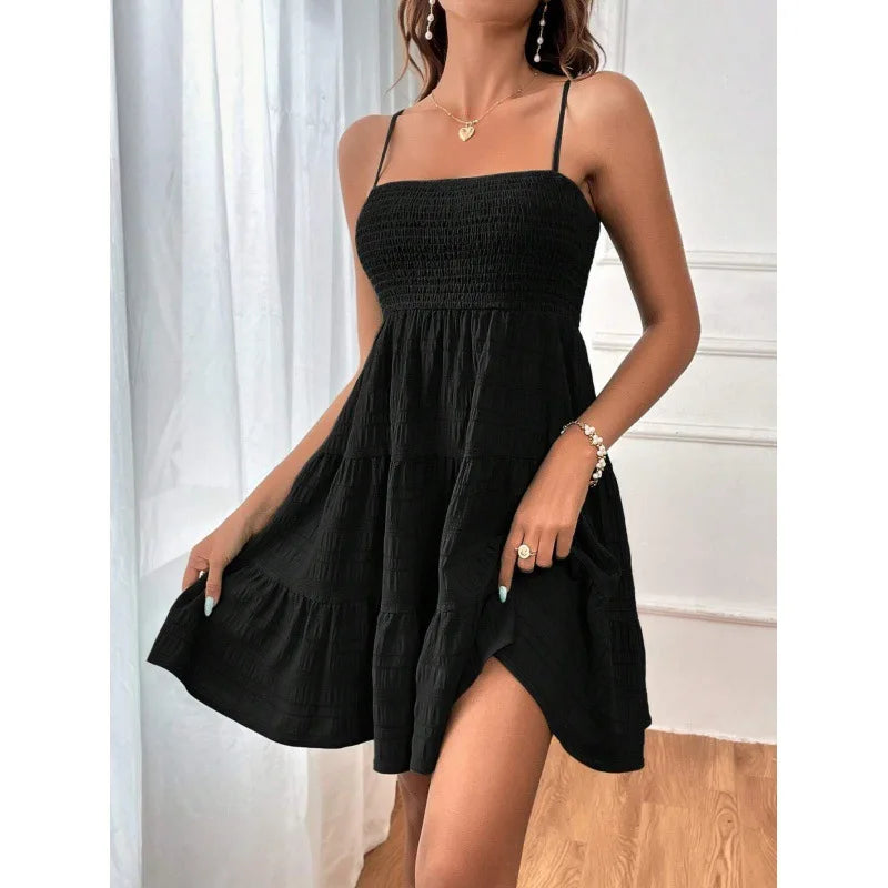 Women's smocked mini dress by MAIRA'S COLLECTIONS featuring a fitted bodice and lightweight fabric, perfect for warm-weather wear.