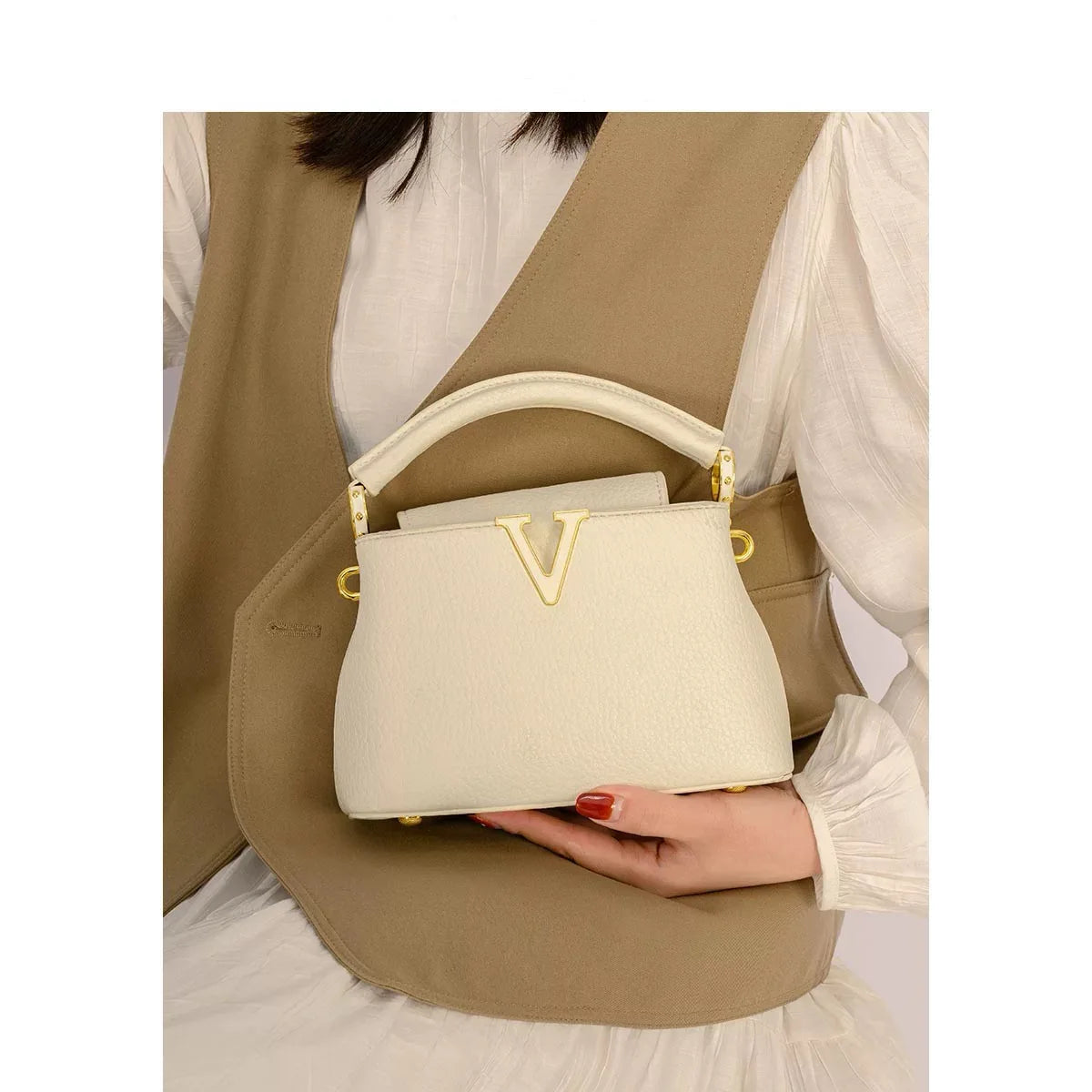 Women's luxury leather crossbody bag by MAIRA'S COLLECTIONS showing sleek design, adjustable strap, and elegant craftsmanship.